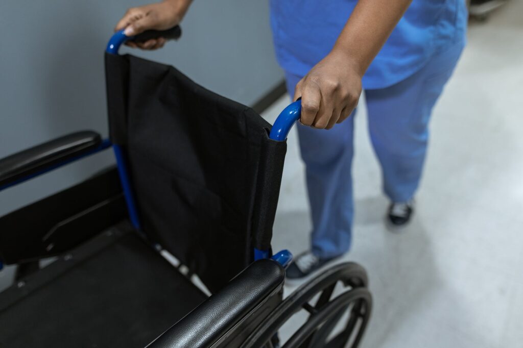 high angle shot of medical practitioner pushing a wheelchair